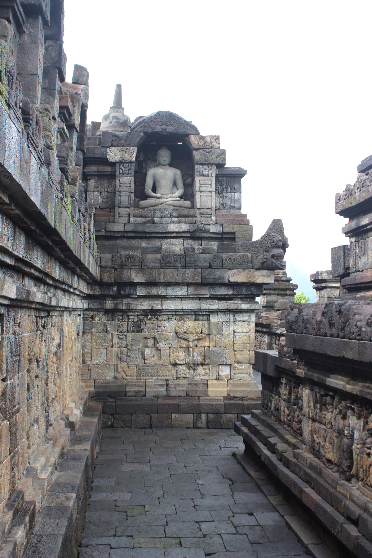 Buddha statue and sculpted walls